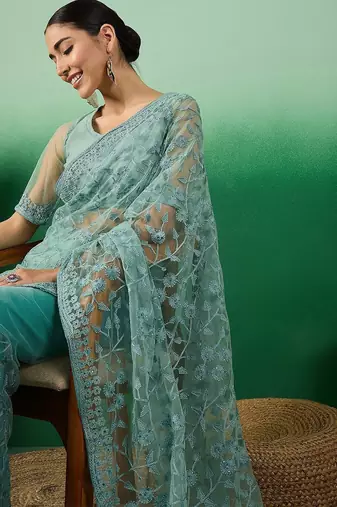 Teal embroidered beads and stones net saree