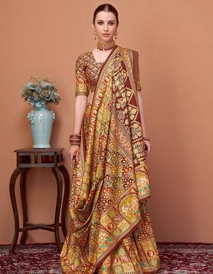 Brown women ethnic motifs printed festive wear saree with matching unstitched blouse 1