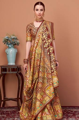 Brown women ethnic motifs printed festive wear saree with matching unstitched blouse