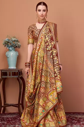 Brown women ethnic motifs printed festive wear saree with matching unstitched blouse