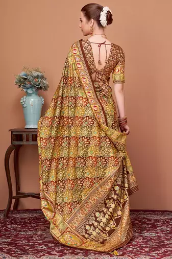 Brown women ethnic motifs printed festive wear saree with matching unstitched blouse