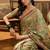 Green floral woven design organza saree with unstitched blouse