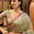 Green floral woven design organza saree with unstitched blouse