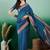 Teal polka dot zari woven tassel detail saree with blouse