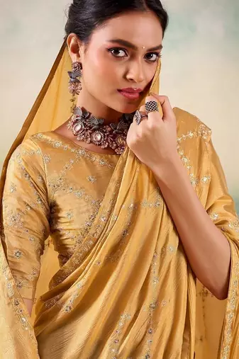 Yellow ethnic embellished festive wear saree with matching blouse