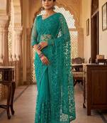 Teal embellished embroidered net designer saree