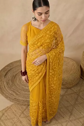 Yellow floral embroidered net designer saree