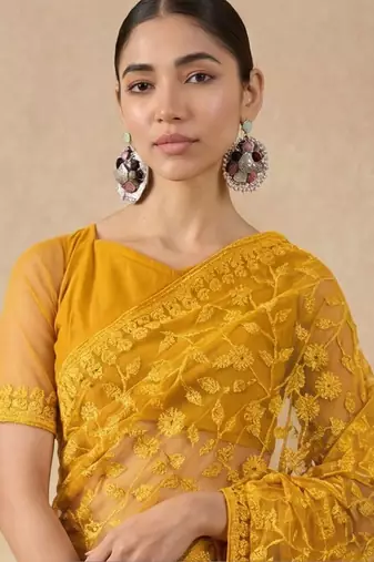 Yellow floral embroidered net designer saree