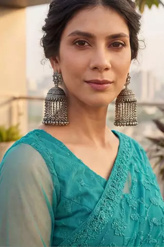 Teal embellished embroidered net designer saree