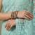 Turquoise embellished embroidered net designer saree