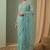 Sea green floral embroidered net designer saree