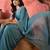 Teal embellished banarasi saree with blouse piece
