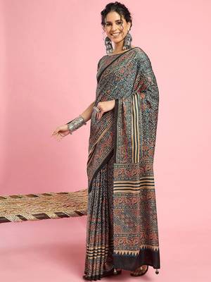 Teal ethnic printed saree with blouse piece 2