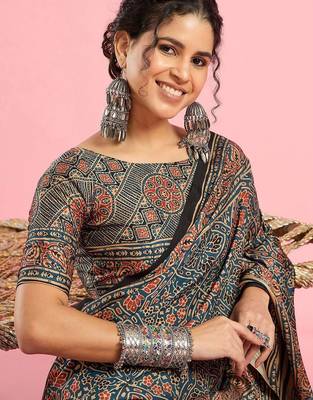 Teal ethnic printed saree with blouse piece 5