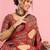 Rust ethnic ajrak printed saree with blouse piece