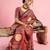 Rust ethnic ajrak printed saree with blouse piece