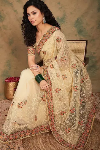 Beige yellow beige embroidered net sarees