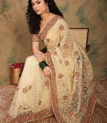 Beige yellow beige embroidered net sarees