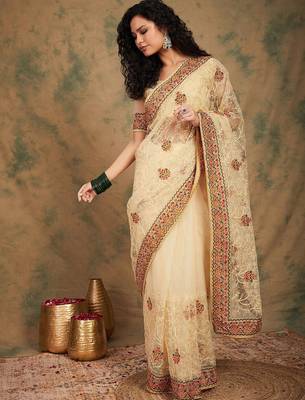 Beige yellow beige embroidered net sarees 2