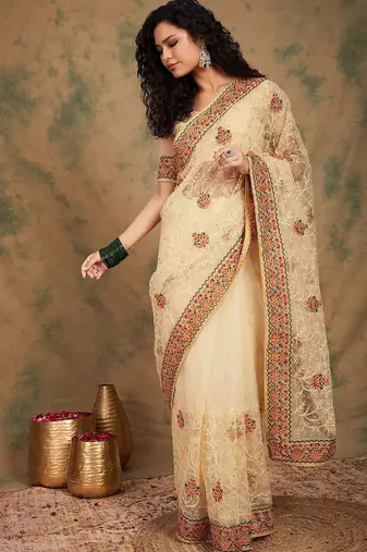 Beige yellow beige embroidered net sarees
