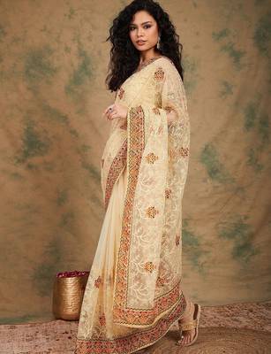 Beige yellow beige embroidered net sarees 3