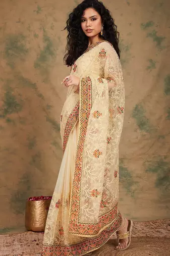 Beige yellow beige embroidered net sarees
