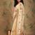 Beige yellow beige embroidered net sarees