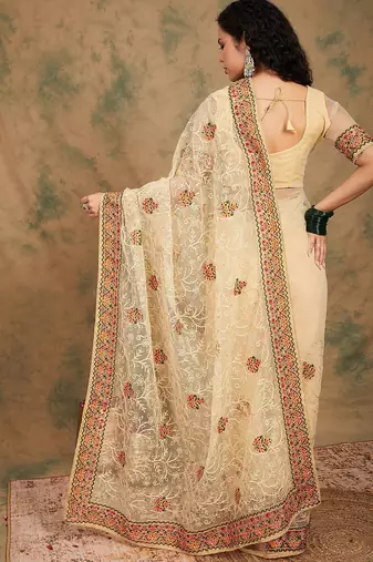 Beige yellow beige embroidered net sarees