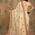 Beige yellow beige embroidered net sarees