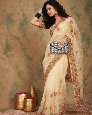 Beige yellow beige embroidered net sarees 5