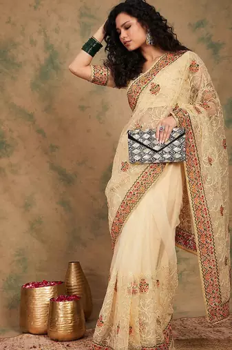 Beige yellow beige embroidered net sarees