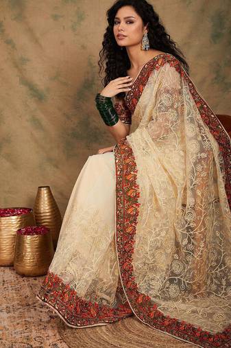 White ethnic motifs embroidered net saree