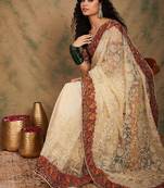 White ethnic motifs embroidered net saree