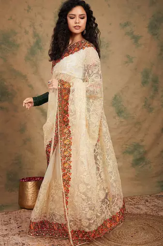 White ethnic motifs embroidered net saree
