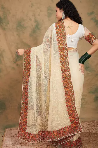 White ethnic motifs embroidered net saree