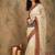 White ethnic motifs embroidered net saree