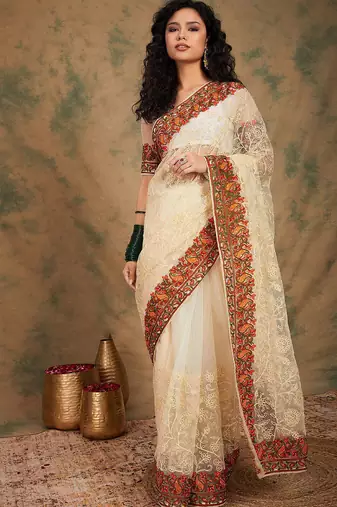White ethnic motifs embroidered net saree