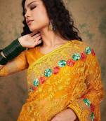 Yellow yellow floral embroidered net sarees