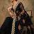 Black black ethnic motifs beads & stones embroidered net saree