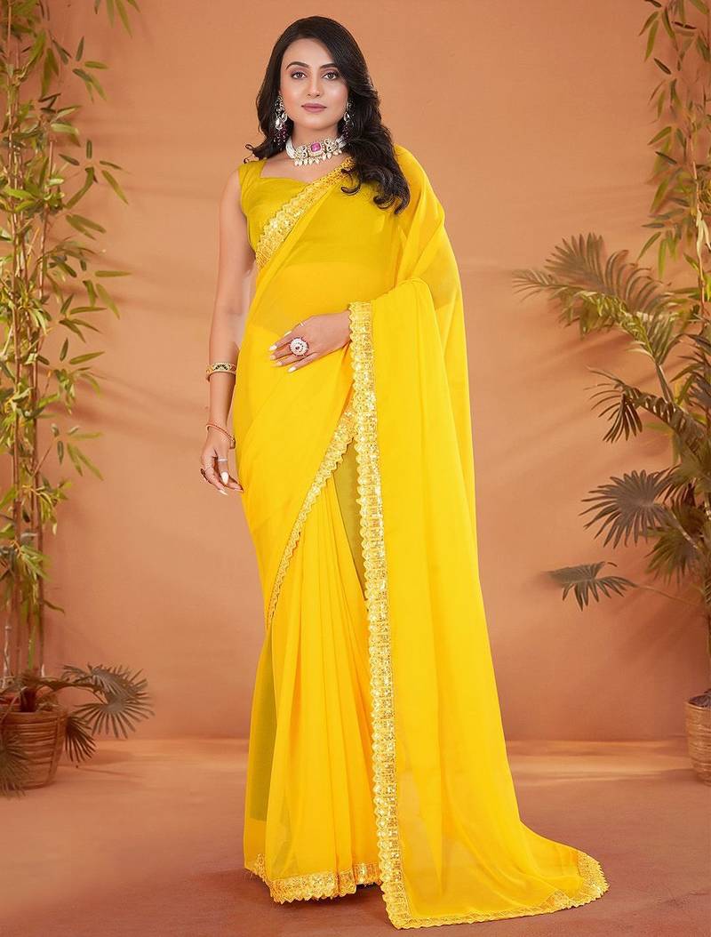 Yellow embellished georgette saree with matching blouse