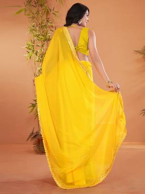 Yellow embellished georgette saree with matching blouse 2