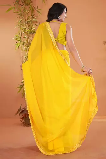 Yellow embellished georgette saree with matching blouse
