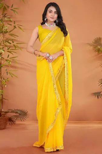 Yellow embellished georgette saree with matching blouse