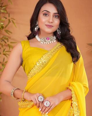 Yellow embellished georgette saree with matching blouse 4