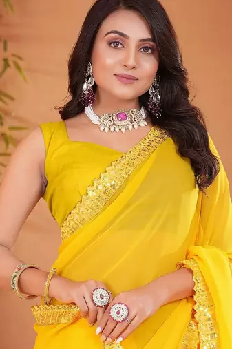 Yellow embellished georgette saree with matching blouse