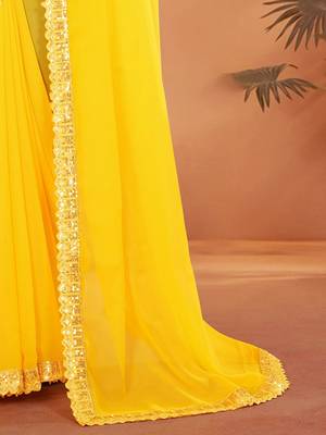Yellow embellished georgette saree with matching blouse 5
