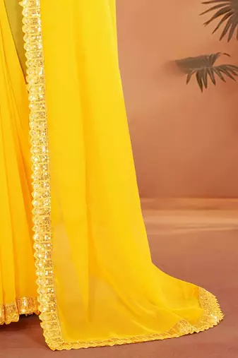 Yellow embellished georgette saree with matching blouse