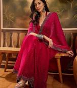 Magenta embellished saree with unstitched blouse