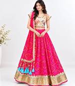 Off white embroidered choli with coral bandhej lehenga set
