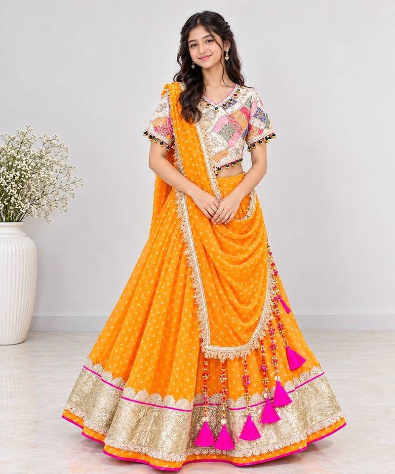 Off white embroidered choli with orange bandhej lehenga set